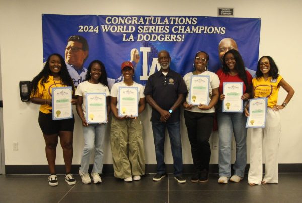 board members with certificates
